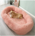 Pink plush winter pet bed with dog showing soft comfortable interior
