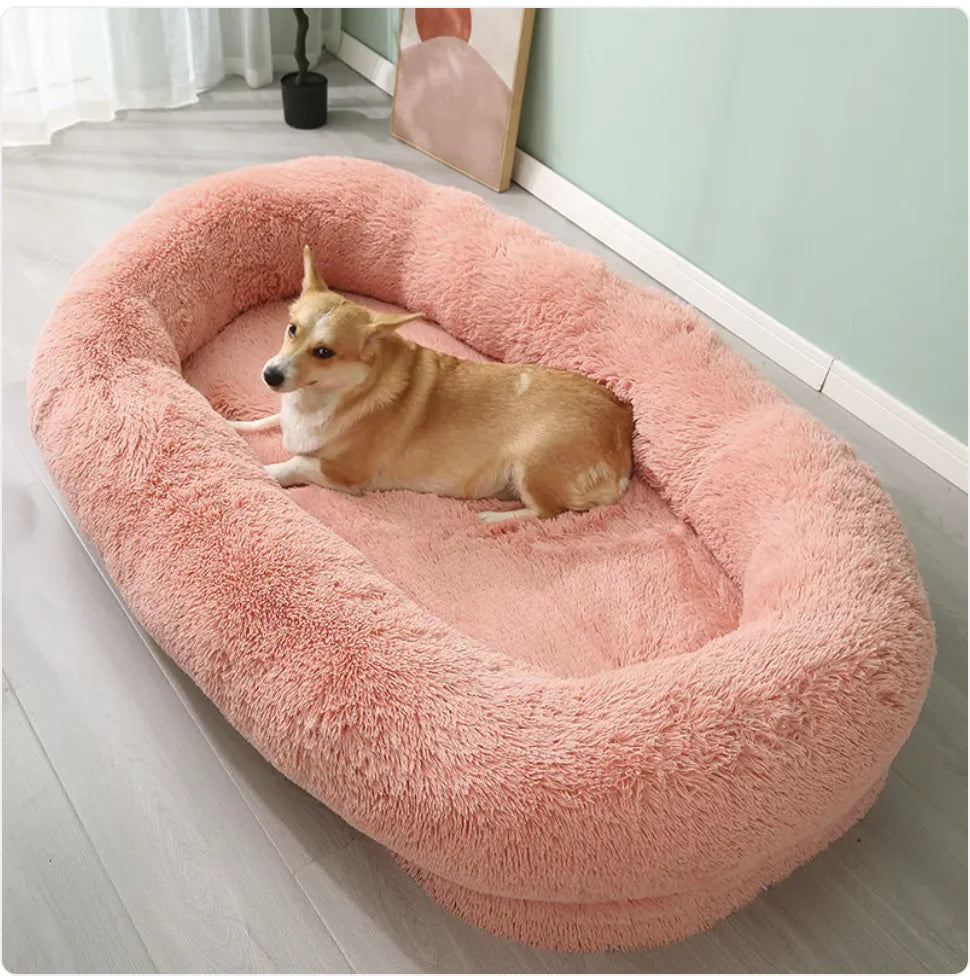 Pink plush winter pet bed with dog showing soft comfortable interior
