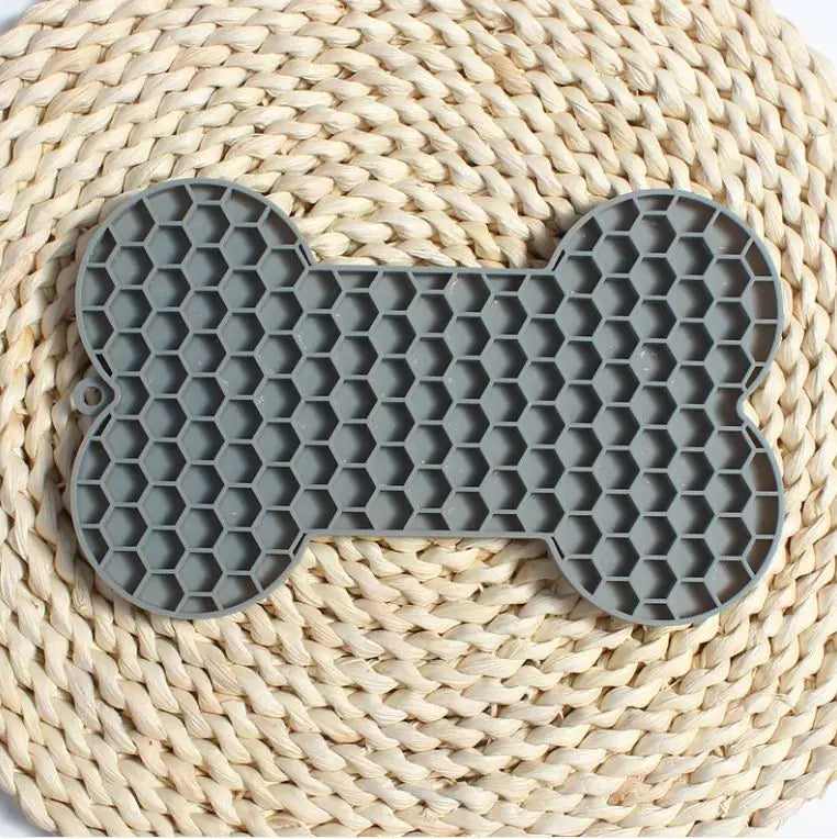 Gray silicone bone shaped slow feeder licking mat for dogs
