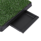 Pet pad with artificial grass surface and black base