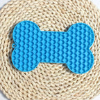 Blue bone silicone licking mat with textured grooves for dogs
