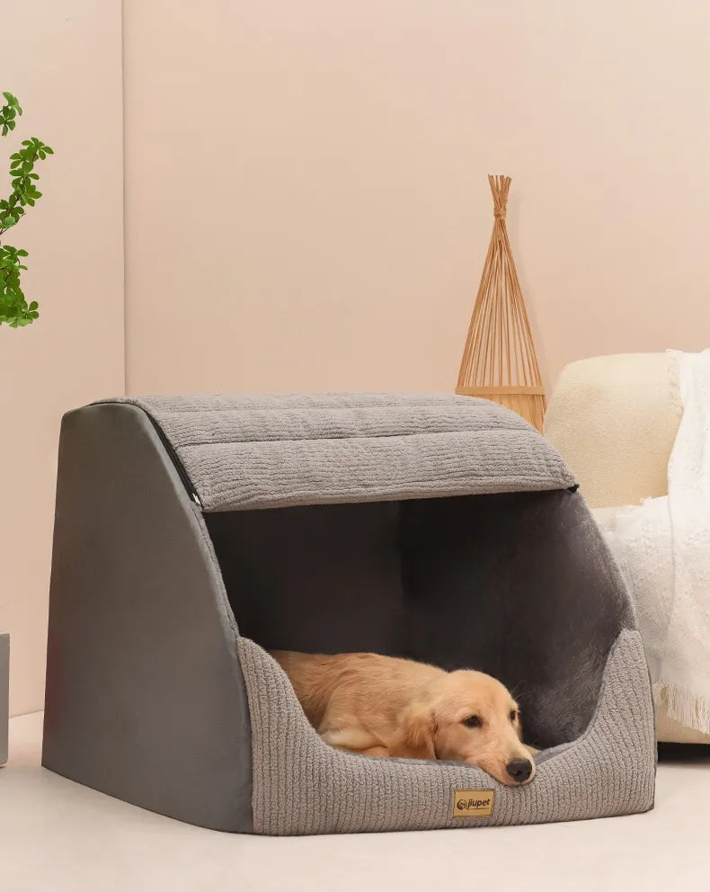 Small dog inside warm gray pet bed showing cozy interior
